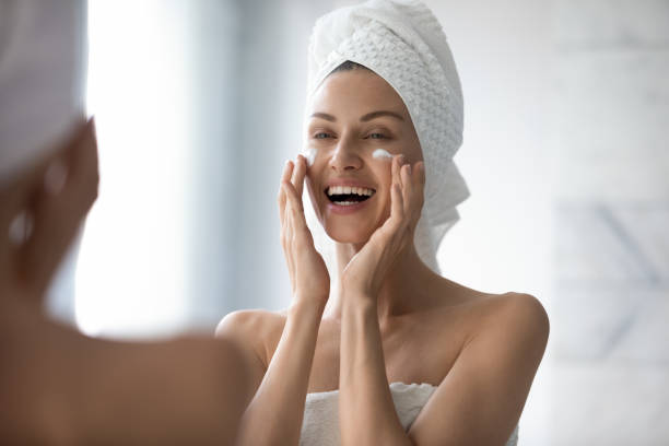 istock Woman touch face apply caring about skin uses moisturiser cream 1260813647
