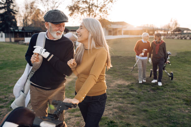 istock Two senior couples enjoying weekend golf play 1260815332