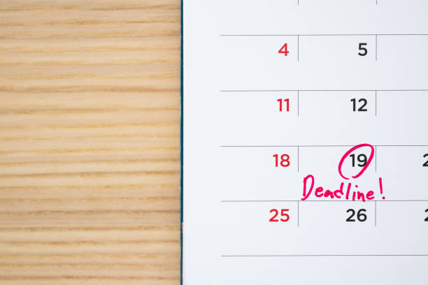 istock Deadline write on white calendar page date close up 1260816849