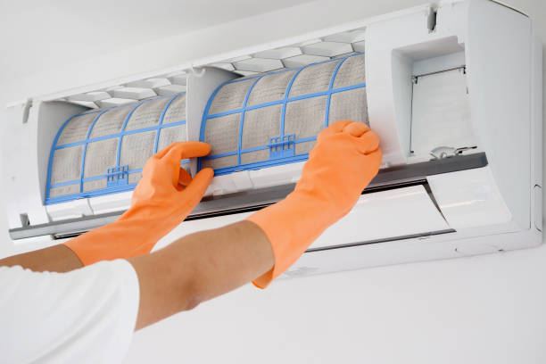 istock Asian man cleaning air conditioner dirty filter 1260817413
