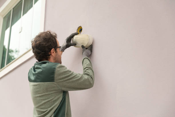 istock Man fixing light fixture on the wall 1260827555