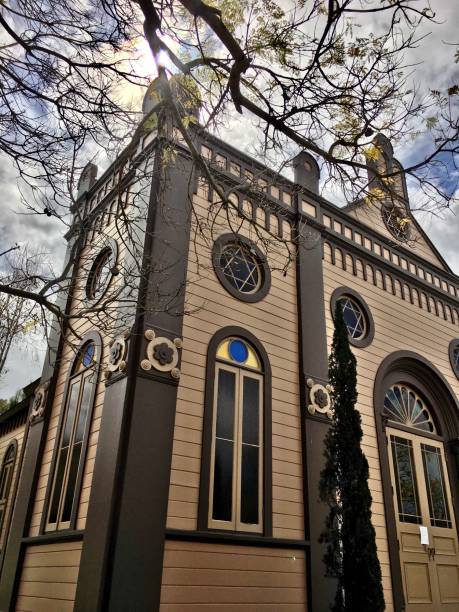 istock high spired brown church corner in the sunshine 1260873667