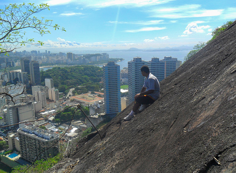 young admiring the look of the hill of the Botafogo neighborhood john are ( morro sao joao ) in Rio de Janeiro, Brazil.