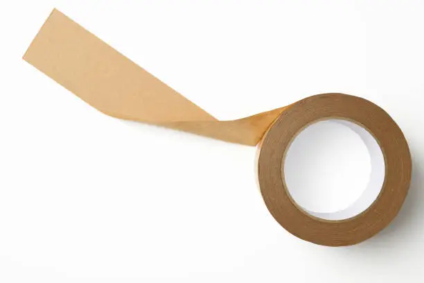 A roll of brown parcel tape isolated on white with clipping path.