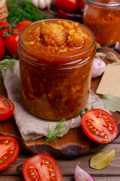 istock Canned cauliflower with vegetables in tomato sauce 1261019409