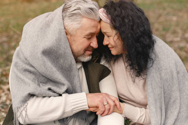 istock Elegant adult couple in a spring forest 1261038061