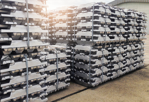 Industrial raw materials, Stack of raw aluminium ingots in aluminium profiles factory.