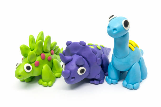 istock Play dough group Brachiosaurus, Triceratopson, Stegosaurus, on white background 1261082796