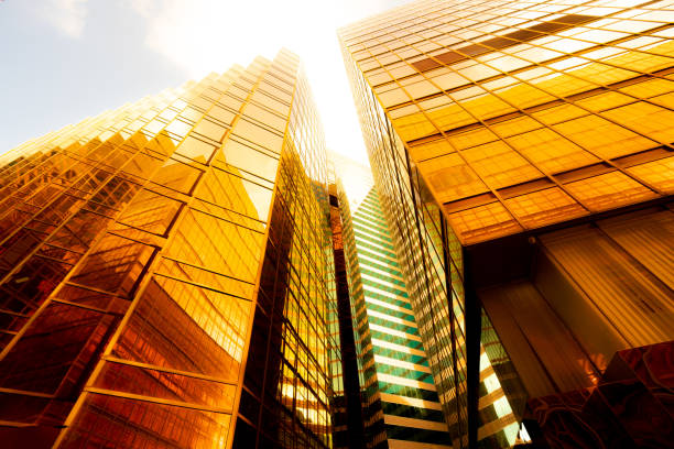 istock Looking up at golden skyscrapers 1261093782