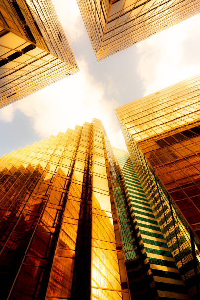 istock Looking up at golden skyscrapers 1261093788