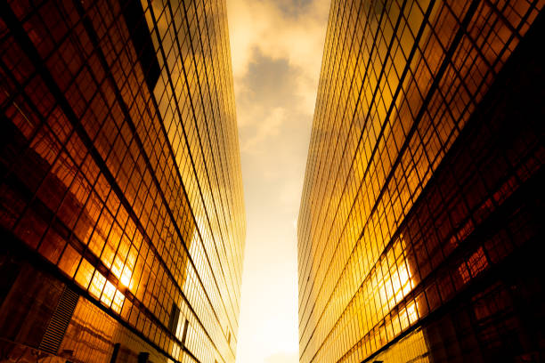 istock Looking up at golden skyscrapers 1261093789