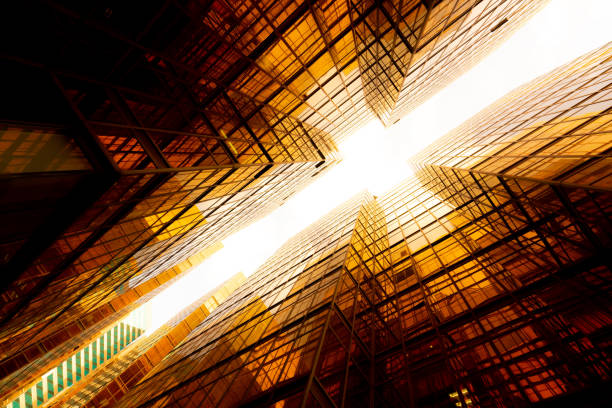 istock Looking up at golden skyscrapers 1261094316