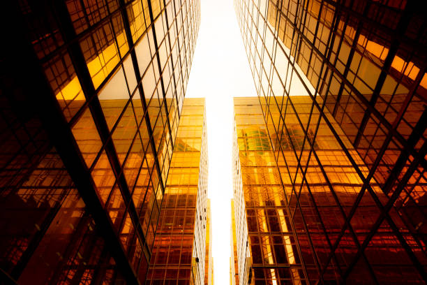 istock Looking up at golden skyscrapers 1261094327