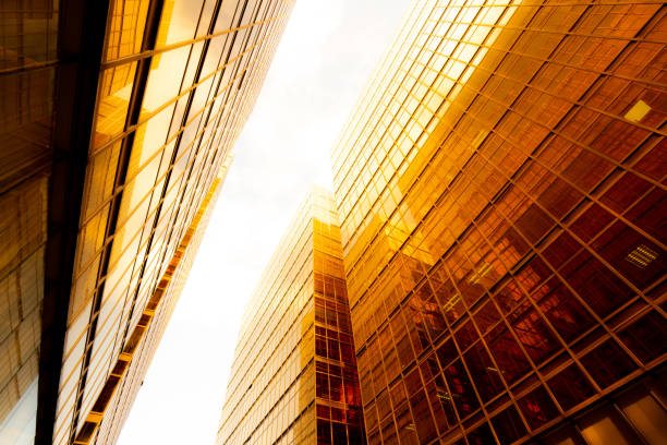 istock Looking up at golden skyscrapers 1261095721