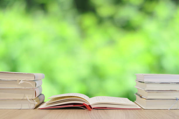 istock A book on a wooden desk - fresh green background image 1261123167