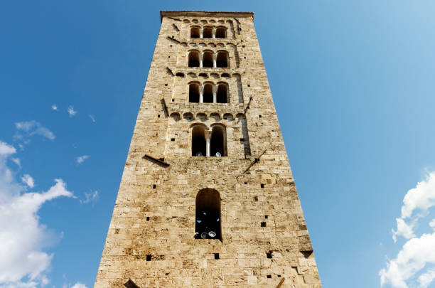 ANAGNI-ITALY-July 2020 -Bell tower of Anagni cathedral against blue sky  ,beautiful square tower with mullioned windows  and triple