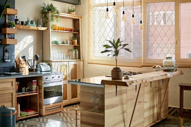 istock Modern Apartment Kitchen and Island with Pendant Lighting 1261144897