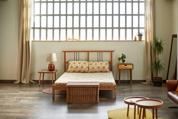 istock Simple Modern Apartment Bedroom with Natural Light 1261144900