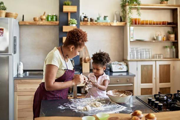 istock Preschool Age Girl Learning How to Bake and Work with Dough 1261144916