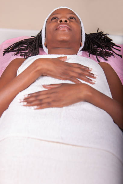 istock african woman with dreadlocks getting ready for a face cosmetic lift 1261155524