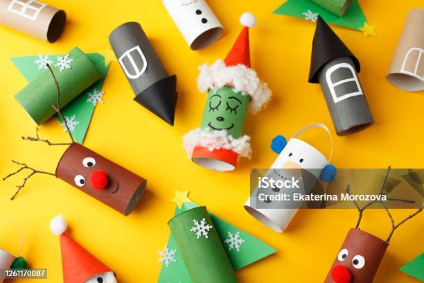 Christmas New Year Crafts Paper Santa Snowman Grinch On Yellow Paper Background With Copy Space For Text Winter Holiday Concept Handcraft Diy Idea Toilet Roll Recycle Stock Photo - Download Image Now