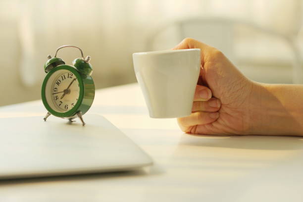 istock A hand with a cup of coffee 1261172772