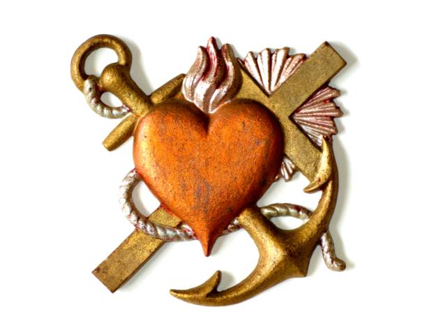 faith, hope, love. hearth, anchor and cross. symbol for trust. - in gold we trust imagens e fotografias de stock