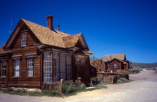Partially restored wooden buildings line the dusty streets of what used to be one of the main cities that arose during the gold rush at the end of the 19th century: Bodie.