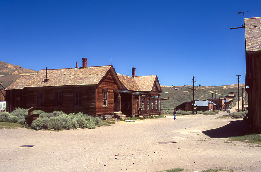 Partially restored wooden houses are what remains of the town of Bodie in the Sierra Nevada. Bodie is the most famous of the ghost towns dating back to the early 20th century.