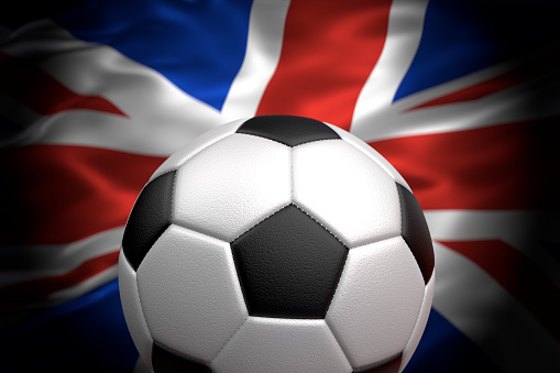 Soccer ball against UK flag 3D illustration