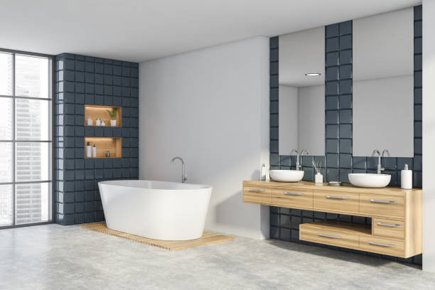istock White and grey tile bathroom corner, sink and tub 1261207924