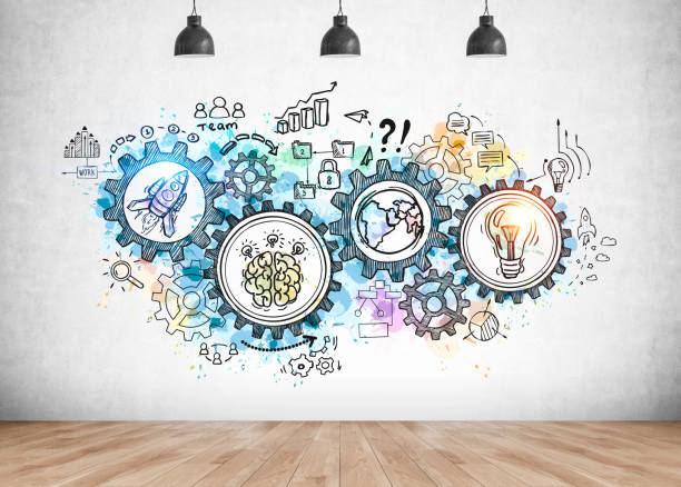 istock Business plan and gears sketch on concrete wall 1261210659