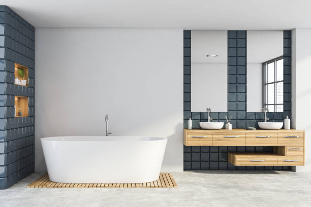 istock White and grey tile bathroom with sink and tub 1261226592