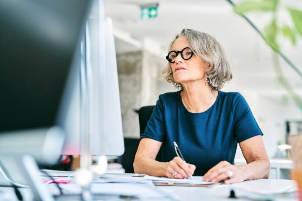 istock Businesswoman working at desk in office 1261229864
