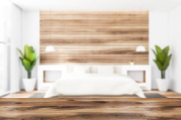 istock Table in blurry white and wooden bedroom 1261231497