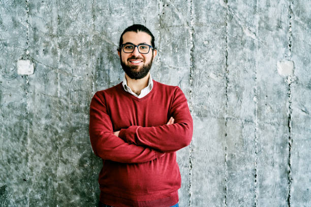 istock Confident creative businessman with arms crossed 1261236787