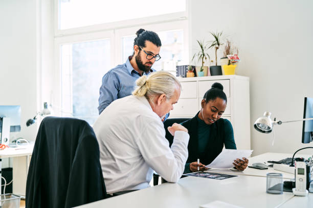 istock Business people discussing in creative office 1261238379