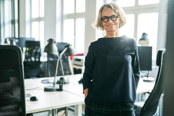 istock Confident mature businesswoman in creative office 1261239458