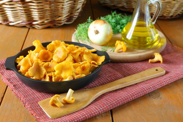 istock Fresh chanterelles mushrooms in a cast iron pan. 1261240006