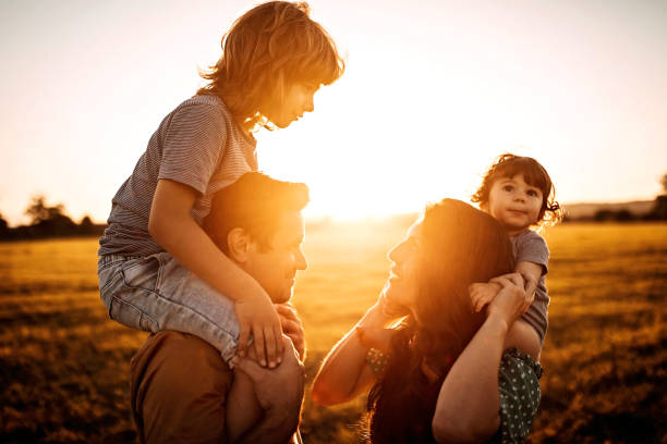 istock Family sharing love in sunset 1261247775