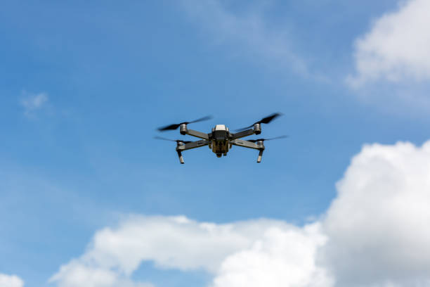 istock Drone copter flying with digital camera.Drone with high resolution digital camera. Flying camera take a photo and video.The drone with professional camera takes pictures of the misty mountains. 1261284920