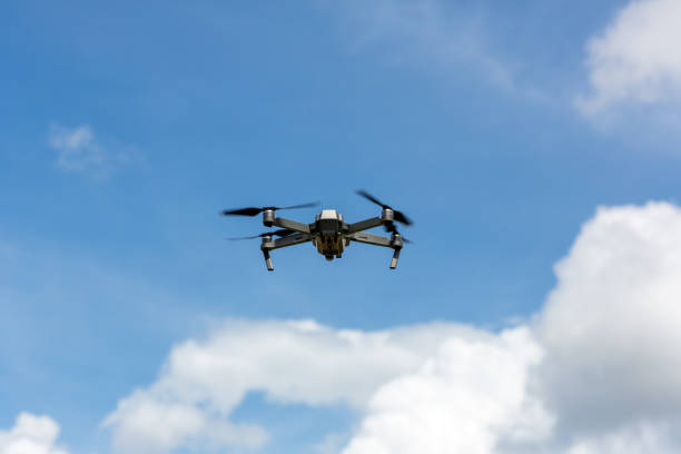 istock Drone copter flying with digital camera.Drone with high resolution digital camera. Flying camera take a photo and video.The drone with professional camera takes pictures of the misty mountains. 1261284922