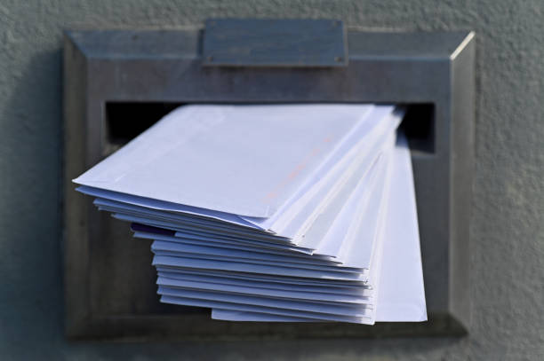 Mailbox full of letters Close up of mailbox full of letters. full term stock pictures, royalty-free photos & images