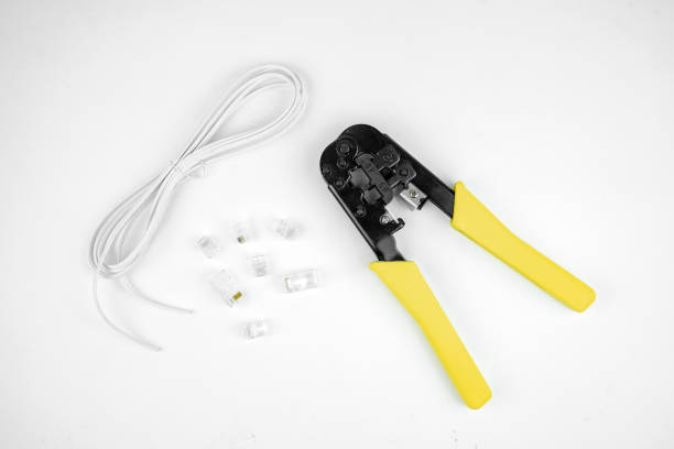 istock internet or telephone line cables and crimper, Twisting Cable Tool Twisted Pair Ethernet UTP Cat 5, Crimping RJ45 LAN cable, Stepping to crimping RJ45 connector 1261293771