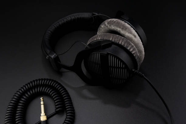 istock Professional recording studio headphones on a black background. Close-up shot 1261301007