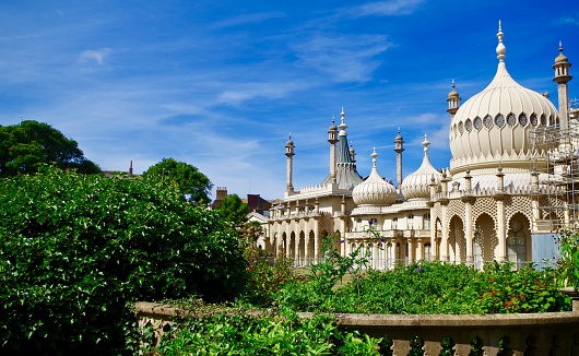 The pavilion in Brighton on a sunny morning with bright blue skies. Taken on Julyl 20th 2020/ The Brighton Royal Pavilion is an exotic palace in the centre of Brighton with a colourful history.