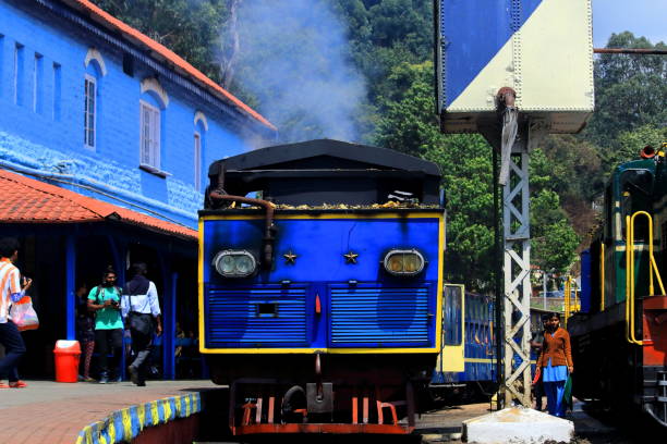 unesco world heritage ooty toy train or nilgiri mountain train (nilgiri mountain railway) at coonoor railway station near ooty ooty, tamilnadu / india - 18th may 2018: unesco world heritage site ooty toy train or nilgiri mountain train (nilgiri mountain railway) at coonoor railway station near ooty hill station tamil nadu landscape stock pictures, royalty-free photos & images