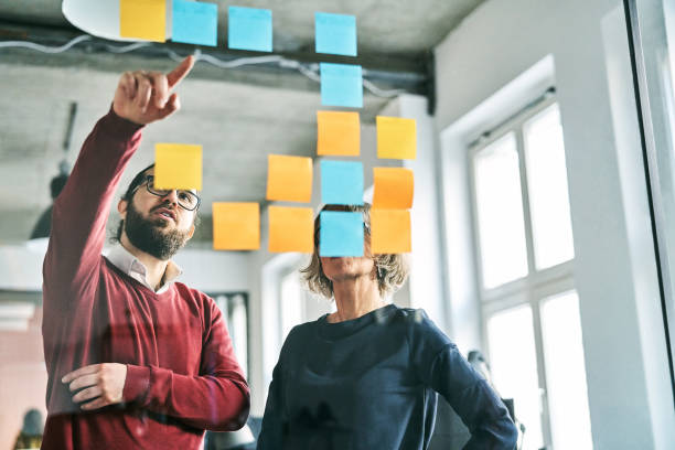 istock Male discussing business strategy with coworker 1261314044