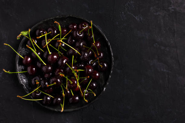 istock Fresh sour cherries in bowl 1261316312