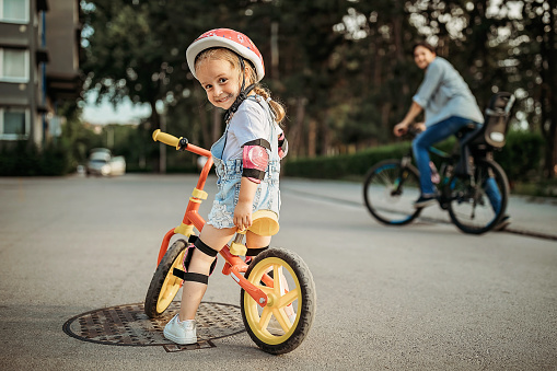 Girl learning to drive a bicycle